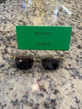 Bottega Veneta Clear Frame Sunglasses with Dark Smoke Lenses and Gold Accents